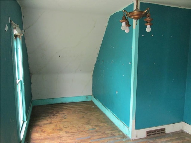 820 Custer St, Trenton, MO 64683 - unfurnished room with visible vents, wood finished floors, and vaulted ceiling