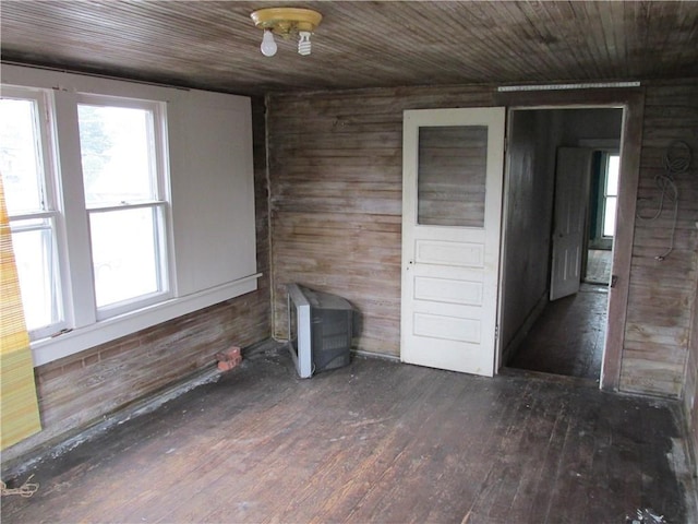 820 Custer St, Trenton, MO 64683 - empty room with wood walls, hardwood / wood-style floors, and wooden ceiling