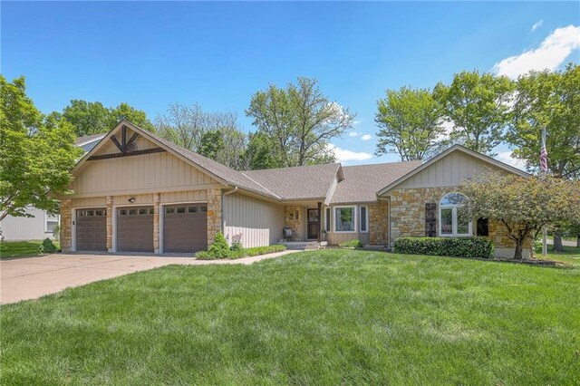 ranch-style home with stone siding, a garage, a front lawn, and concrete driveway