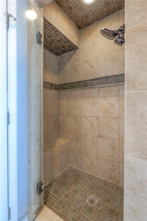 bathroom featuring a shower stall