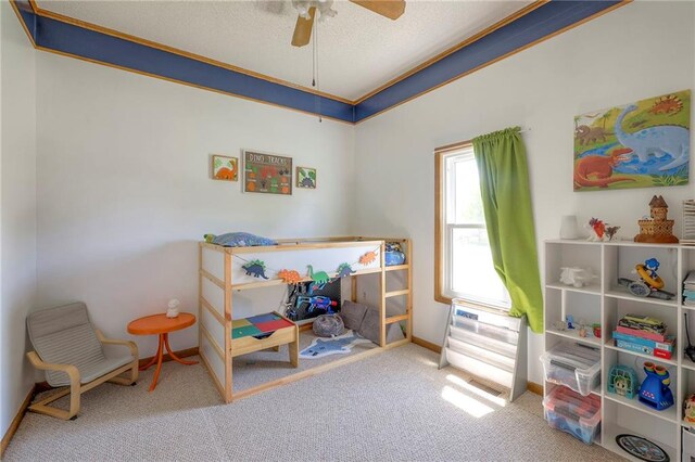 carpeted bedroom featuring a ceiling fan and baseboards