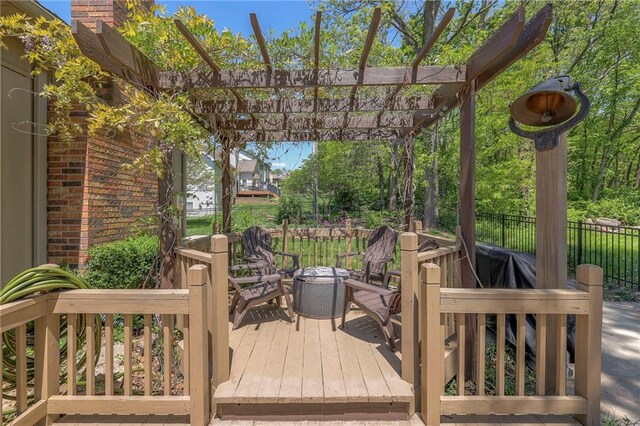 deck with fence and a pergola