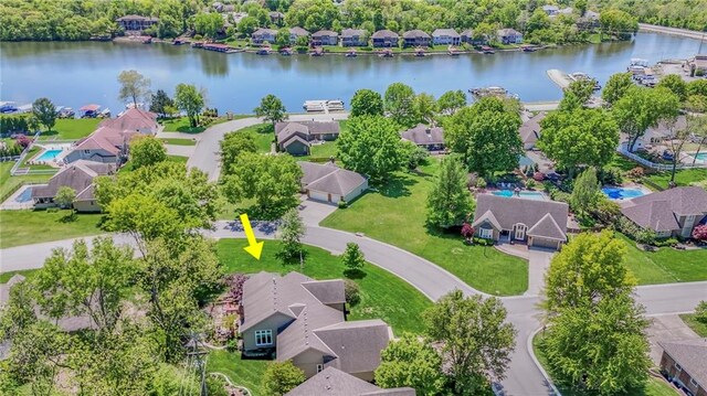 aerial perspective of suburban area with a nearby body of water