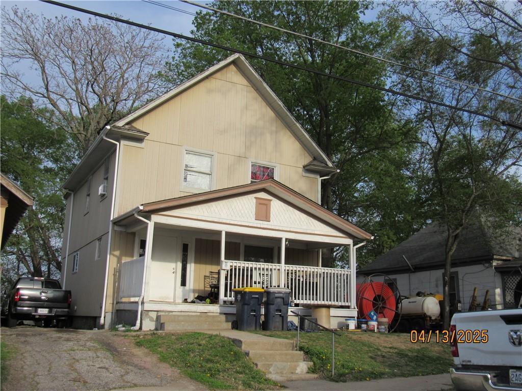 traditional style home with heating fuel and a porch