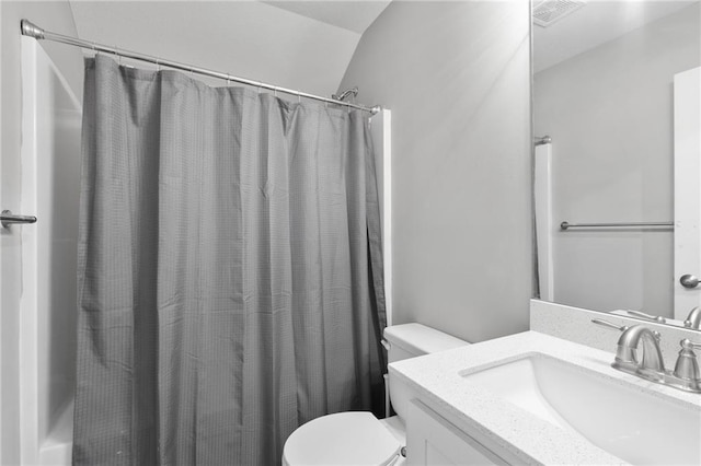 bathroom featuring visible vents, toilet, and vanity