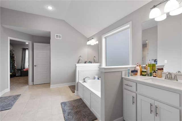 full bath with a bath, visible vents, vaulted ceiling, vanity, and tile patterned floors