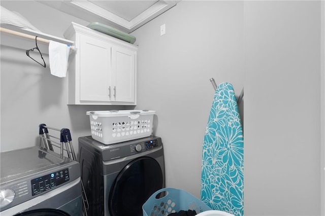 laundry room with cabinet space and washer and dryer