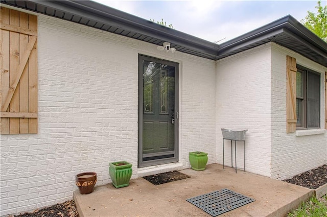 1204 E 223rd St, Cleveland, MO 64734 - doorway to property featuring a patio