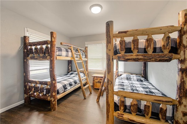 1204 E 223rd St, Cleveland, MO 64734 - bedroom featuring baseboards and wood finished floors
