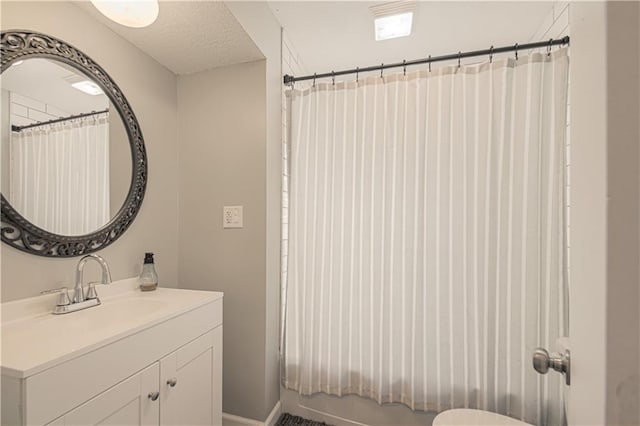 1204 E 223rd St, Cleveland, MO 64734 - full bathroom with vanity and a textured ceiling