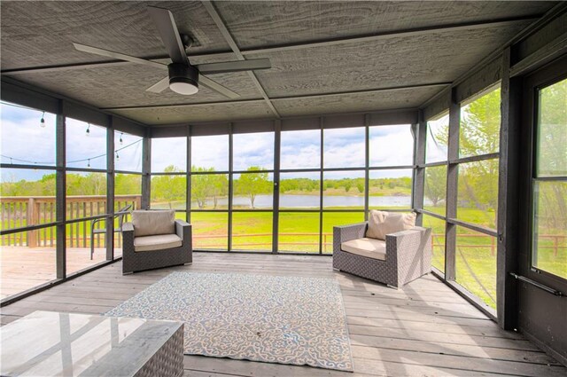 1204 E 223rd St, Cleveland, MO 64734 - sunroom with a water view and ceiling fan