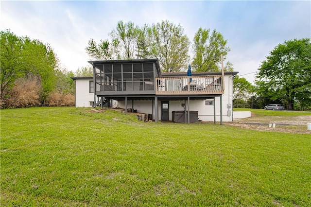 1204 E 223rd St, Cleveland, MO 64734 - rear view of house with a lawn, a wooden deck, and a sunroom