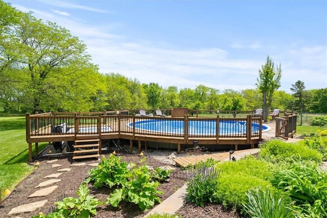 14305 S Gammon Rd, Greenwood, MO 64034 - view of swimming pool featuring a wooden deck and view of scattered trees
