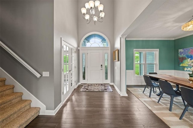 14305 S Gammon Rd, Greenwood, MO 64034 - foyer entrance featuring a chandelier, stairs, hardwood / wood-style floors, ornamental molding, and a wainscoted wall