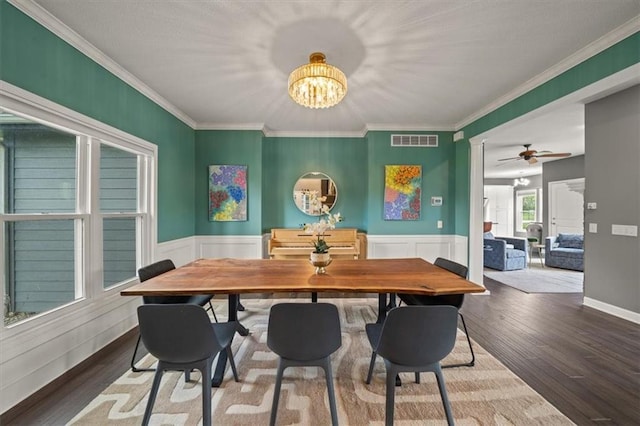 14305 S Gammon Rd, Greenwood, MO 64034 - dining area featuring a chandelier, wood finished floors, wainscoting, ornamental molding, and ceiling fan