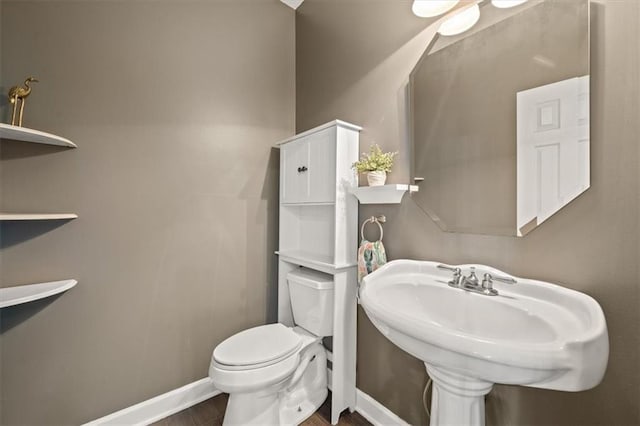 14305 S Gammon Rd, Greenwood, MO 64034 - bathroom featuring toilet and wood finished floors