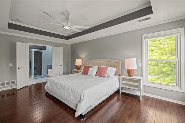 14305 S Gammon Rd, Greenwood, MO 64034 - bedroom featuring a raised ceiling, hardwood / wood-style floors, ornamental molding, a ceiling fan, and ensuite bathroom