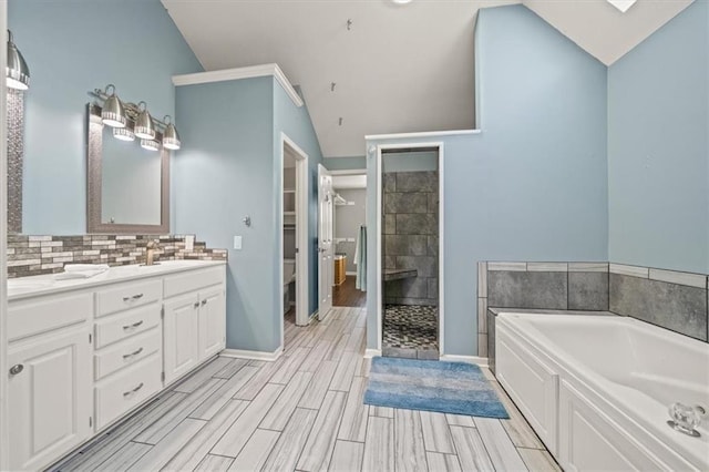 14305 S Gammon Rd, Greenwood, MO 64034 - bathroom with a garden tub, double vanity, lofted ceiling, a tile shower, and decorative backsplash