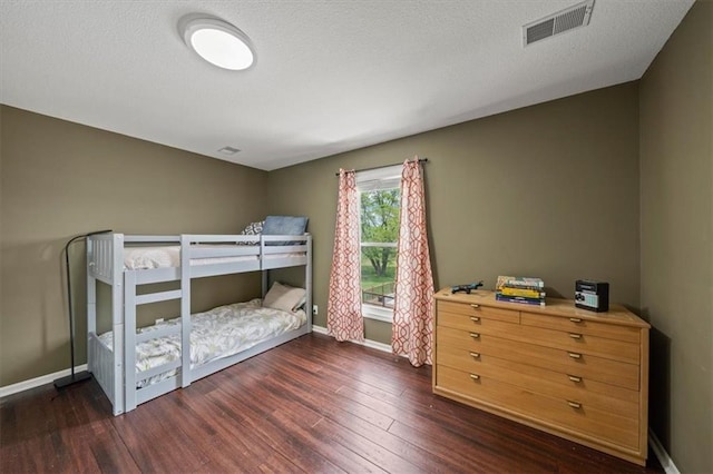 14305 S Gammon Rd, Greenwood, MO 64034 - bedroom with dark wood-style flooring and baseboards