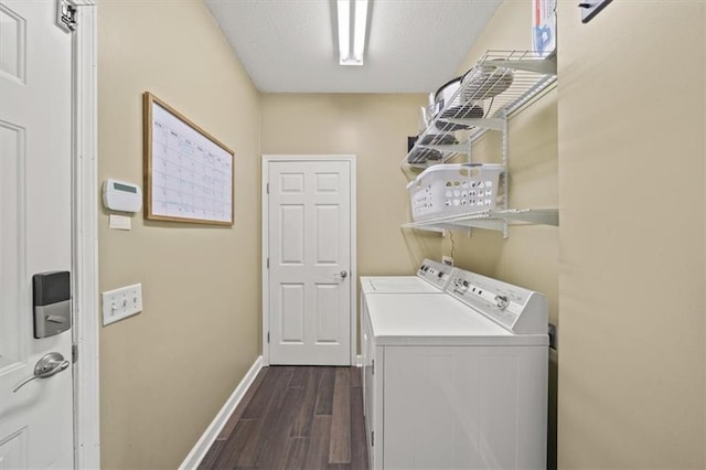 14305 S Gammon Rd, Greenwood, MO 64034 - laundry area featuring washer and clothes dryer, dark wood-type flooring, and a textured ceiling