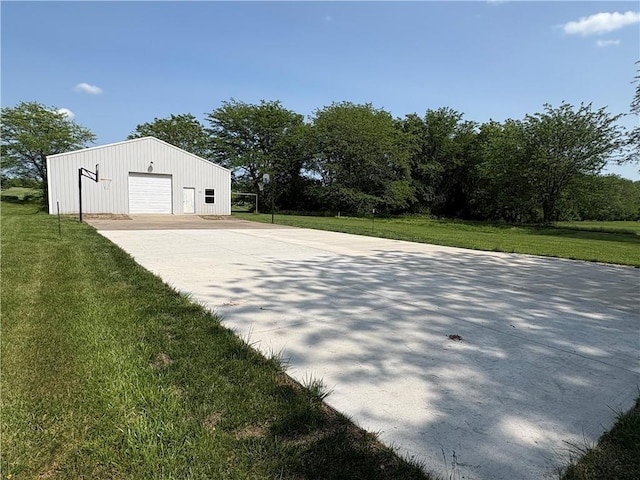 14305 S Gammon Rd, Greenwood, MO 64034 - detached garage featuring driveway