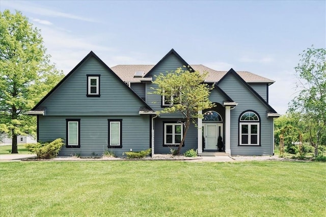 14305 S Gammon Rd, Greenwood, MO 64034 - view of front facade with a front lawn and roof with shingles