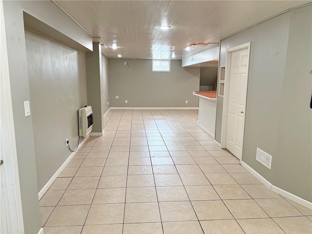 14305 S Gammon Rd, Greenwood, MO 64034 - below grade area with heating unit, light tile patterned floors, and wooden ceiling