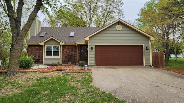 ranch-style home with a garage, fence, a chimney, brick siding, and concrete driveway