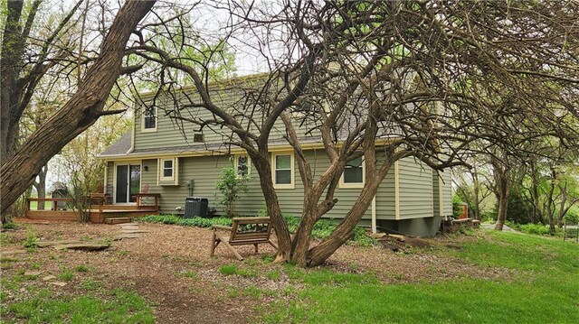 back of property featuring a deck