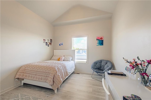 4515 67th Ter, Kansas City, MO 64119 - bedroom featuring vaulted ceiling, light wood-type flooring, and baseboards