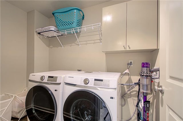 4515 67th Ter, Kansas City, MO 64119 - clothes washing area with washer and clothes dryer and cabinet space
