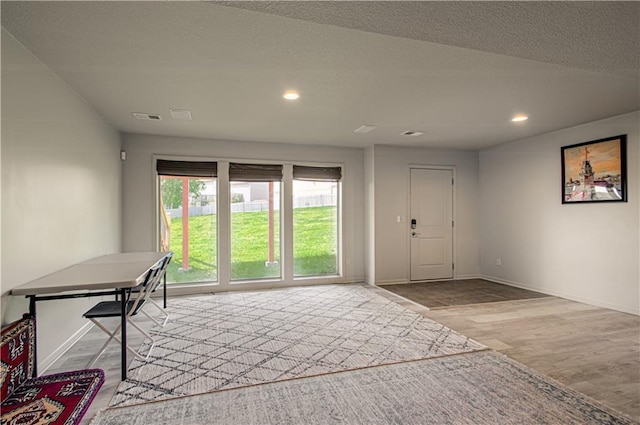 4515 67th Ter, Kansas City, MO 64119 - doorway with wood finished floors, recessed lighting, and baseboards