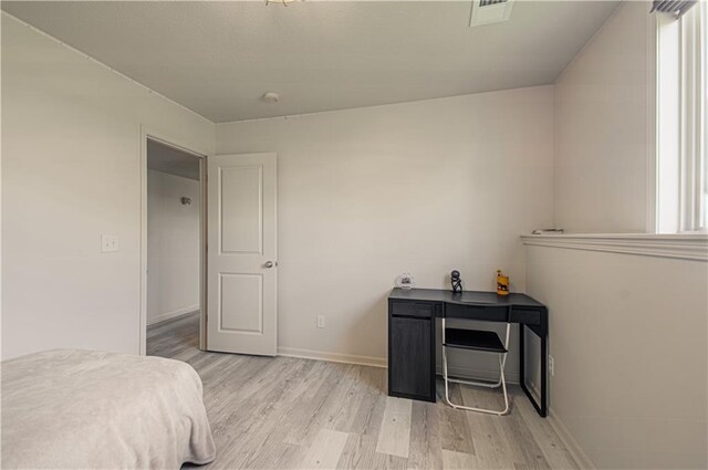 4515 67th Ter, Kansas City, MO 64119 - bedroom with light wood-style flooring and baseboards
