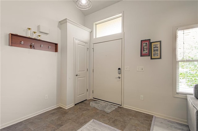 4515 67th Ter, Kansas City, MO 64119 - foyer featuring plenty of natural light and baseboards