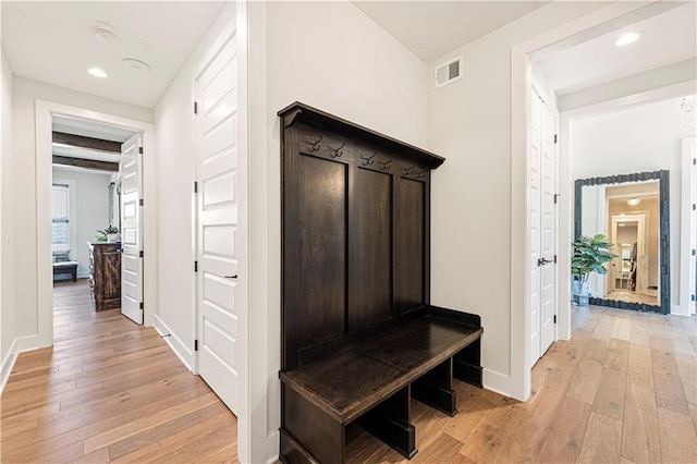 mudroom with recessed lighting, baseboards, light wood-type flooring, and visible vents