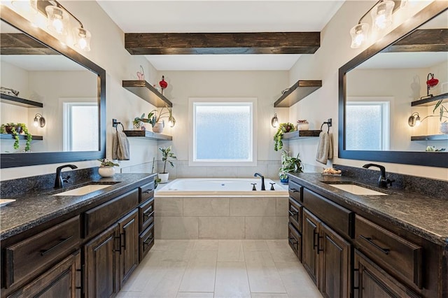 bathroom with a sink, a bath, and beamed ceiling