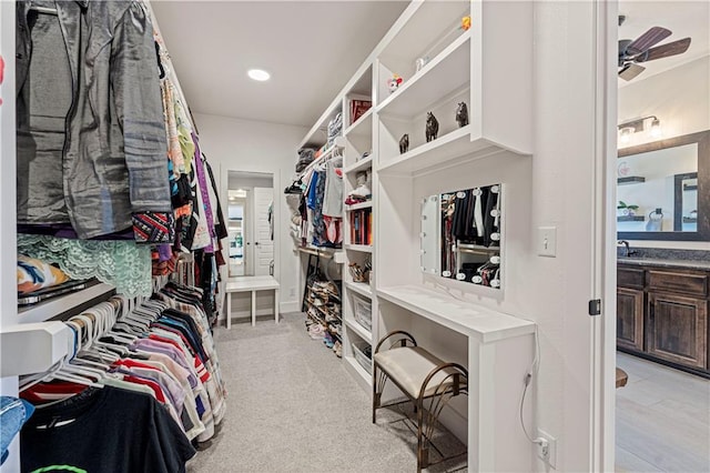 spacious closet with a ceiling fan
