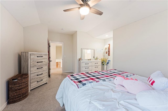 bedroom with baseboards, light colored carpet, and vaulted ceiling