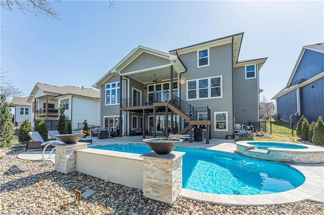 back of property featuring stairway, a patio, ceiling fan, and fence