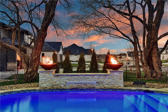 view of pool with fence and a fenced in pool