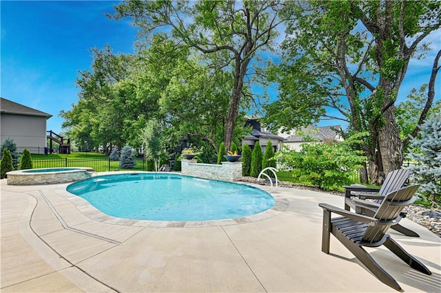 11212 W 170th Pl, Overland Park, KS 66221 - view of swimming pool featuring a patio area and a pool with connected hot tub