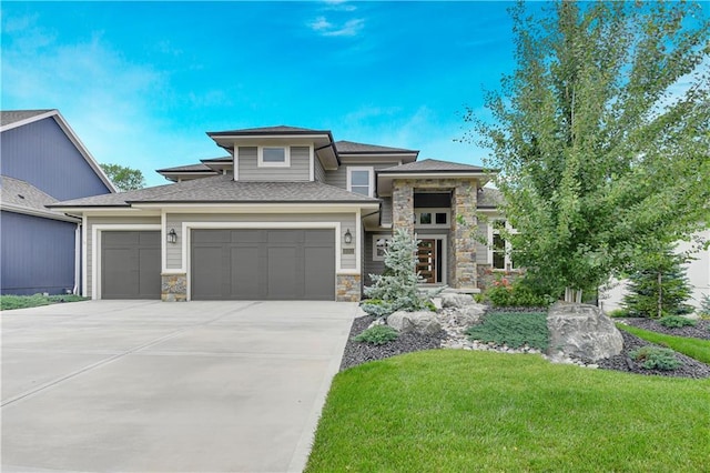 11212 W 170th Pl, Overland Park, KS 66221 - prairie-style home with stone siding, driveway, a front yard, an attached garage, and a shingled roof
