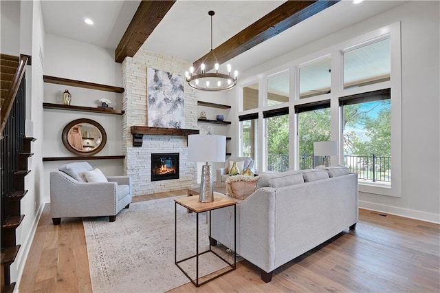 11212 W 170th Pl, Overland Park, KS 66221 - living area with beam ceiling, a chandelier, baseboards, a fireplace, and wood finished floors
