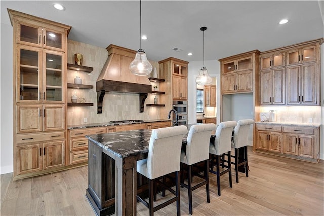 11212 W 170th Pl, Overland Park, KS 66221 - kitchen with stainless steel appliances, backsplash, light wood finished floors, and recessed lighting