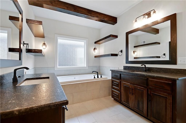 11212 W 170th Pl, Overland Park, KS 66221 - bathroom with beamed ceiling, a garden tub, two vanities, and tile patterned floors