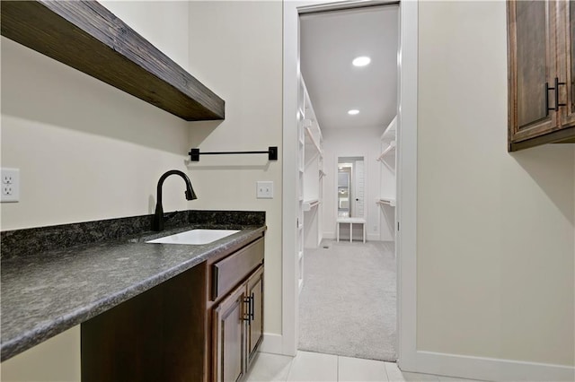 11212 W 170th Pl, Overland Park, KS 66221 - bar area with a sink, light colored carpet, light tile patterned flooring, recessed lighting, and baseboards