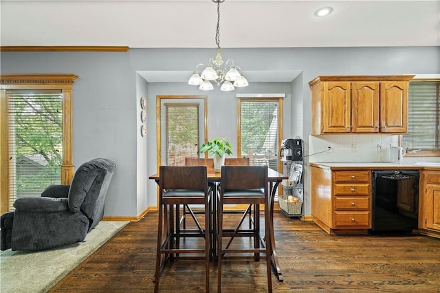 dining space with recessed lighting, baseboards, dark wood finished floors, and a chandelier