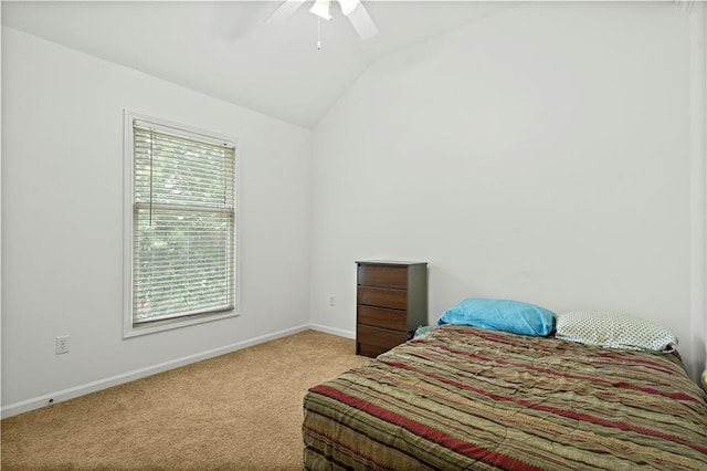 carpeted bedroom featuring baseboards, ceiling fan, and lofted ceiling