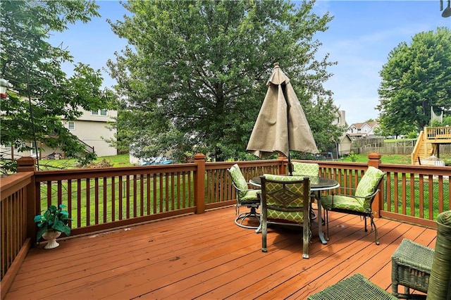 wooden terrace featuring outdoor dining area