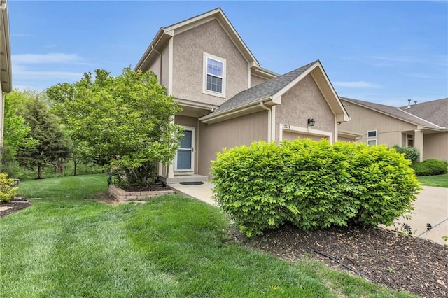 view of property exterior featuring stucco siding and a yard